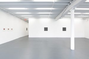 Gallery view of multiple works on all sides.