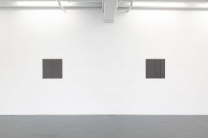 Gallery view of two works straight on.