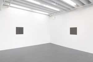 Two works on perpendicular walls.