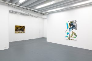 Gallery view, yellow work to the left, blue work to the right.