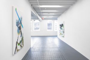 View of two works in gallery.