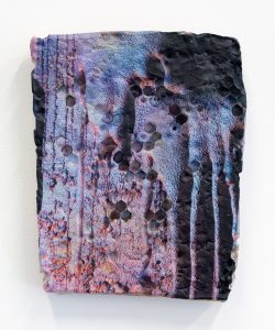 Colorful, porous object in organic shape.