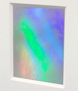 Closeup of foil from the side showing a myriad of colors.
