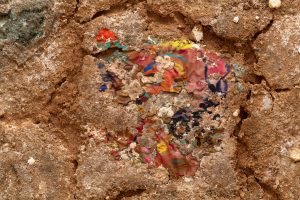 Detailed view of various colors dispersed on earthy surface
