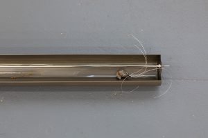Wires affixed to hardened glass ball inside steel exterior