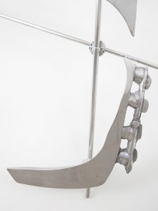 Detailed view of aluminum components of sculpture made with aluminum and plaster