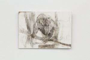 An obscured grey and white figure appears huddled in the center of the panel.