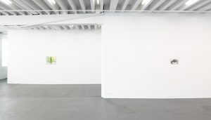 Gallery view of one green painting and one grey painting.