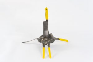 A side view of the previous sculpture. The handles are painted yellow.